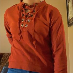 Reddish orange sweatshirt